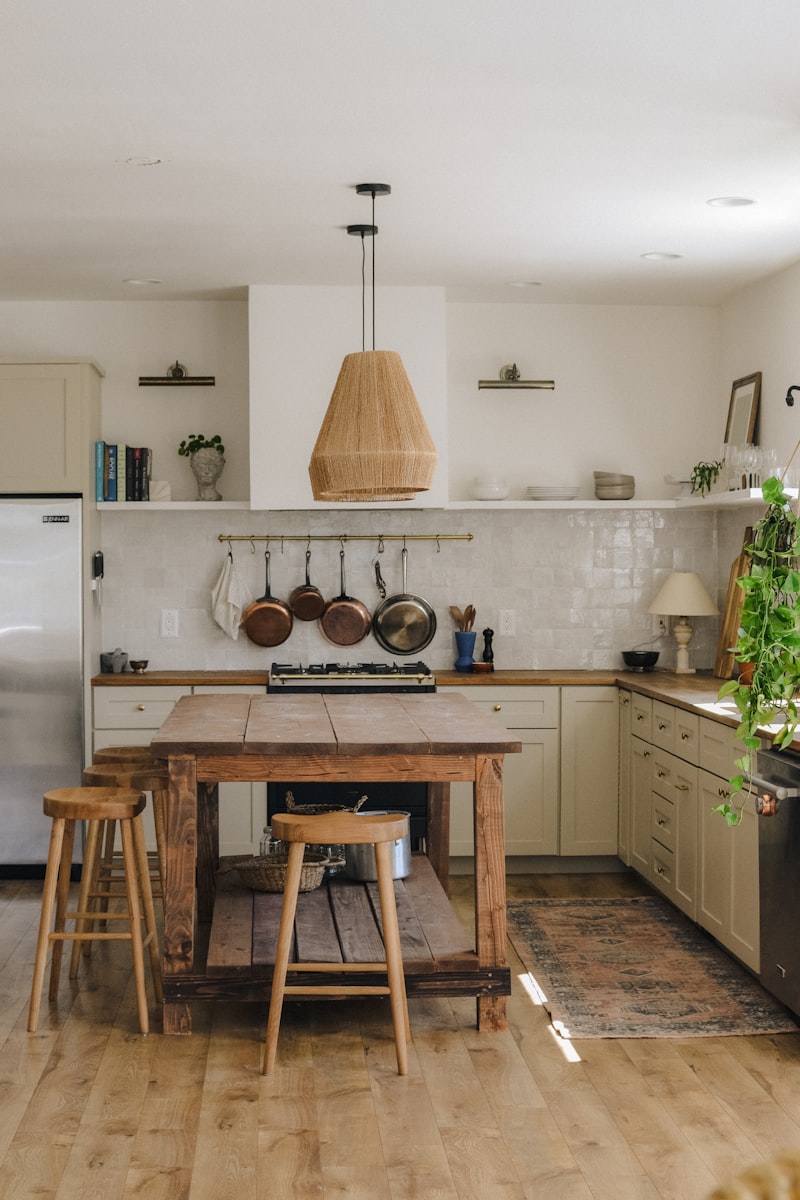 A kitchen with a timber island and stools
